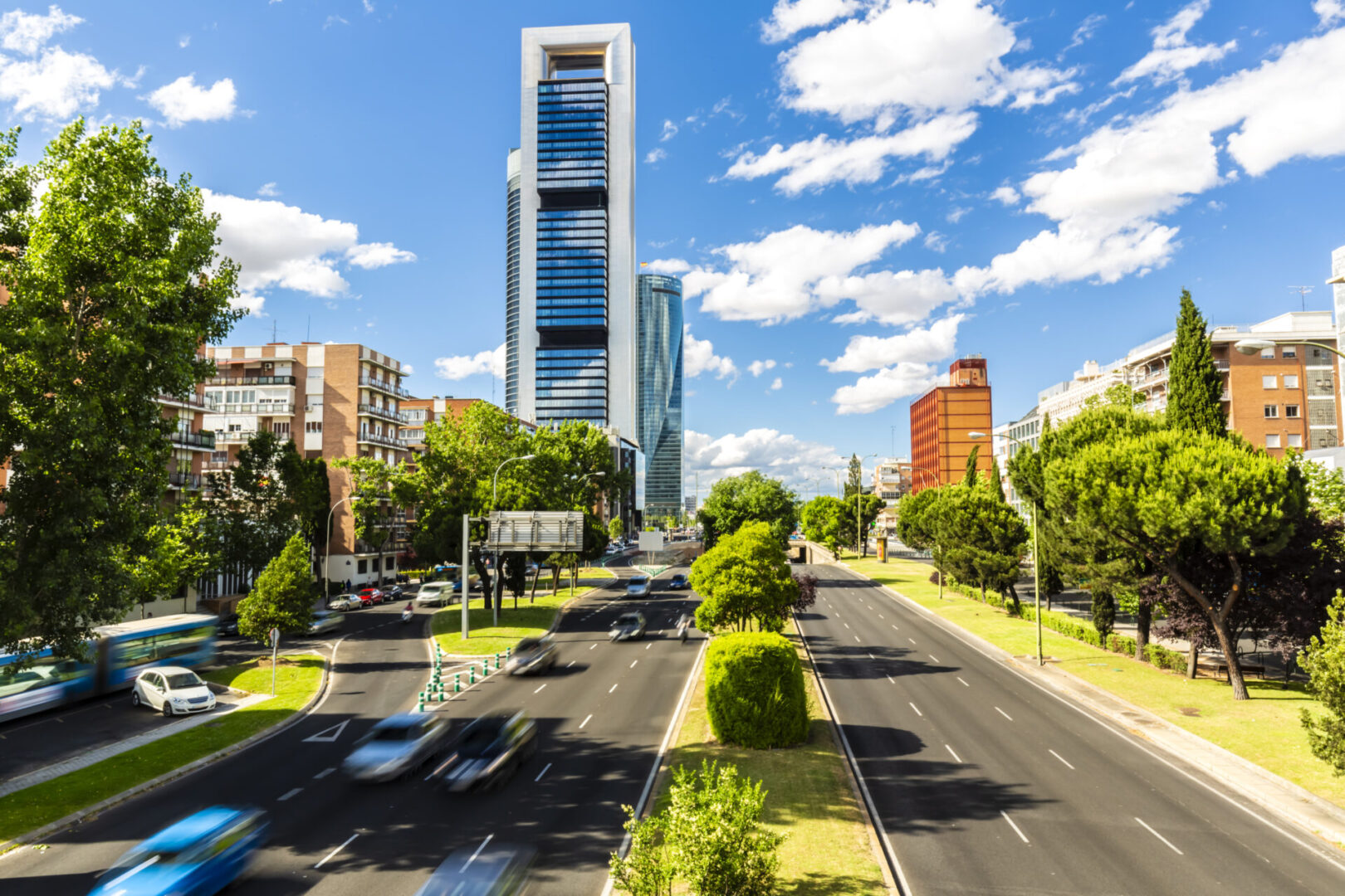 Madrid cityscape with skyscrapers and avenue.