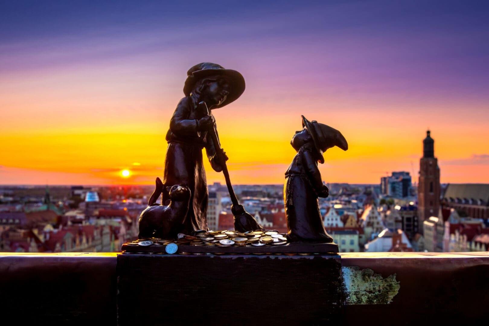 Wroclaw gnomes. Witches Tekla and Martynka on the Penitents Bridge (aka Mostek Pokutnic) between towers of St. Mary Magdalene's Church. High quality photo
